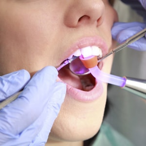 Photo of young girl enjoying the latest dental technologies that dentists NYC have to offer.